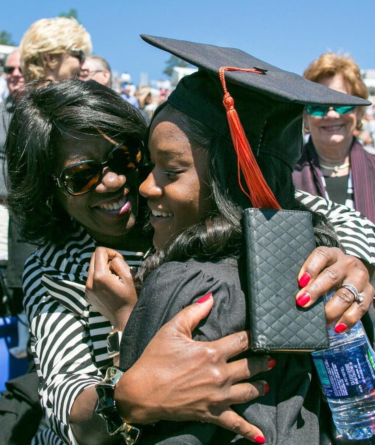 Marion Matthew, a BSE Mechanical Engineering graduate, hugs her mother, Dayna Matthew, following the 164th Commencement Exercises at Duke University in Durham, N.C., Sunday, May 15, 2016. More than 5,300 degrees were conferred.