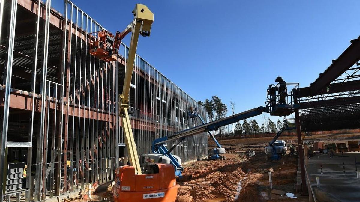In December 2015, construction workers scrambled to complete Oakview Elementary School in Holly Springs, built with funds from an $810 million bond issue approved by voters in 2013.