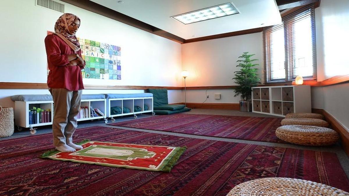 Duke student Yossra Hamid, a senior, stands on her prayer rug in The Mosaic, a prayer room in Keohane dorm Thursday, February 18, 2016. The room is open for prayer and meditation by students of all faiths. She prays five times a day and said she welcomed the university’s willingness to accommodate the diverse religious practices of its student body. Hamid, whose parents are from Sudan, found Duke to be a very welcoming campus for Muslims. “I was overwhelmed in a good way,” she said. “That was one of the reasons I came to Duke.”