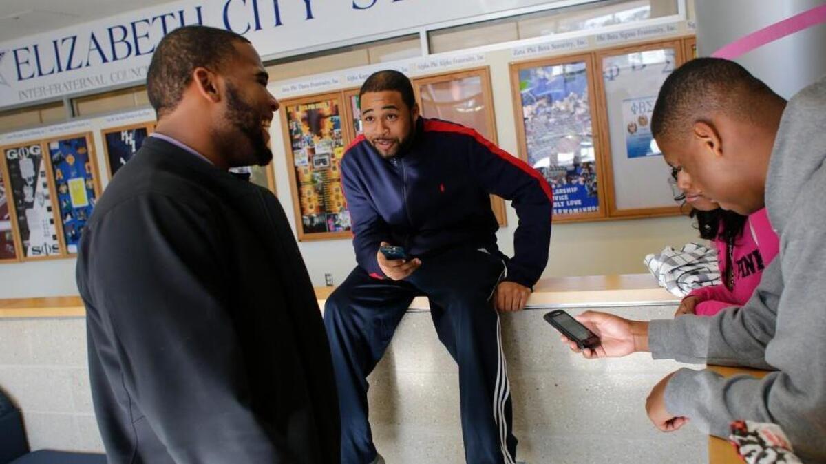 From left, Jonathan McPherson, Terrence Raycrow, Karishma Appadu, and Julian Davis socialize between classes Tuesday, January 21, 2014 at Elizabeth City State University's Ridley Student Center.