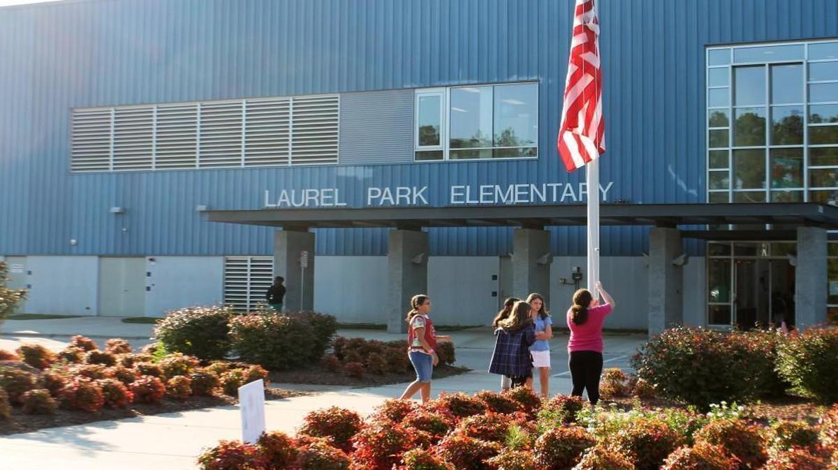 Laurel Park Elementary students raise the flag before school in 2013.