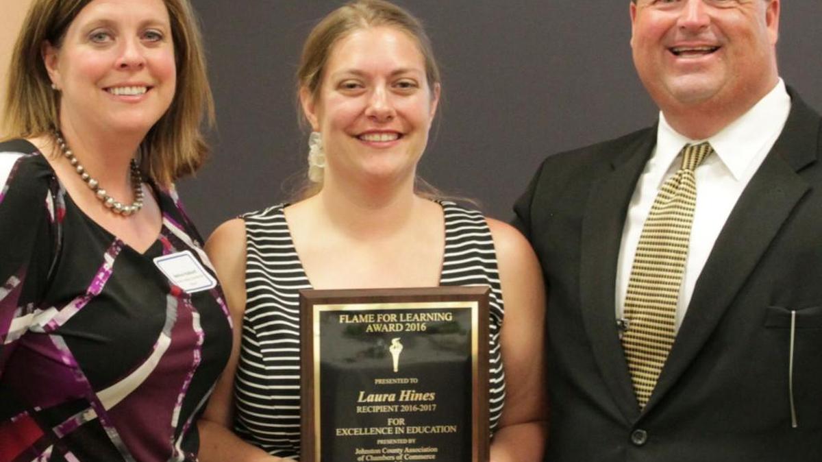 Corinth-Holders Elementary School’s Laura Hines, center, is the 2016 Flame for Learning Award winner. Standing with her are Corinth-Holders Elementary Principal Melissa Hubbard and Johnston Superintendent of Schools Ross Renfrow.