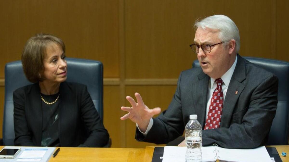 N.C. State University Chancellor Randy Woodson, right, and UNC-Chapel Hill Chancellor Carol Folt speak to The News & Observer editorial board in this Feb. 29, 2016, file photo.