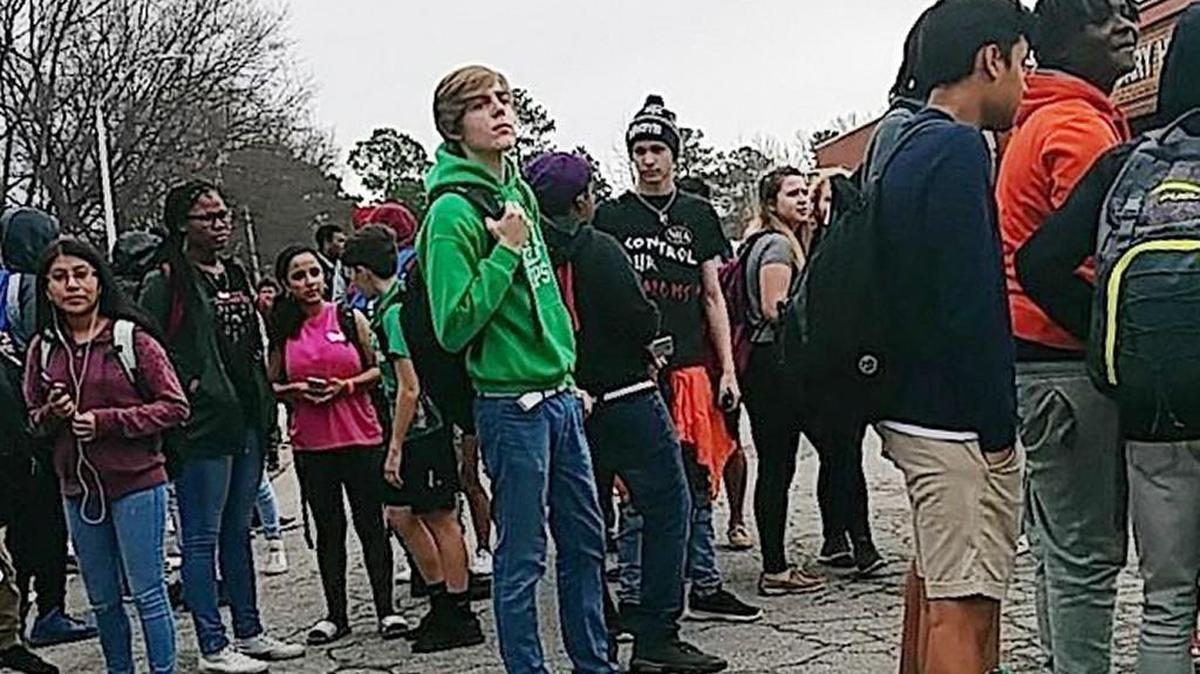 A group of Cary High School students walked out of class Tuesday, Feb. 20, 2018, to protest gun violence in schools.