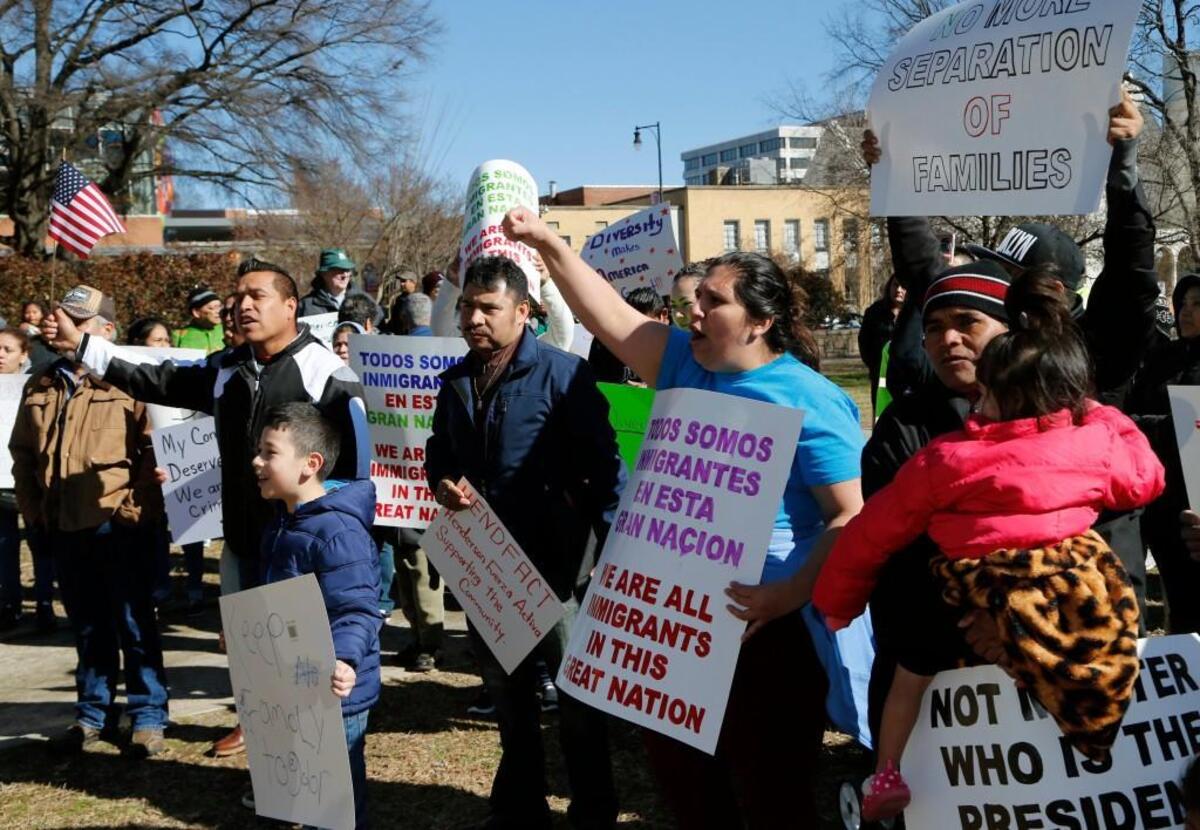 Protesters chant slogans in Spanish as hundreds come out to protest the federal government's immigration policies during a rally held at Moore Square in Raleigh, NC on Feb. 16, 2017. It was part of the nationwide "Day Without Immigrants" movement.