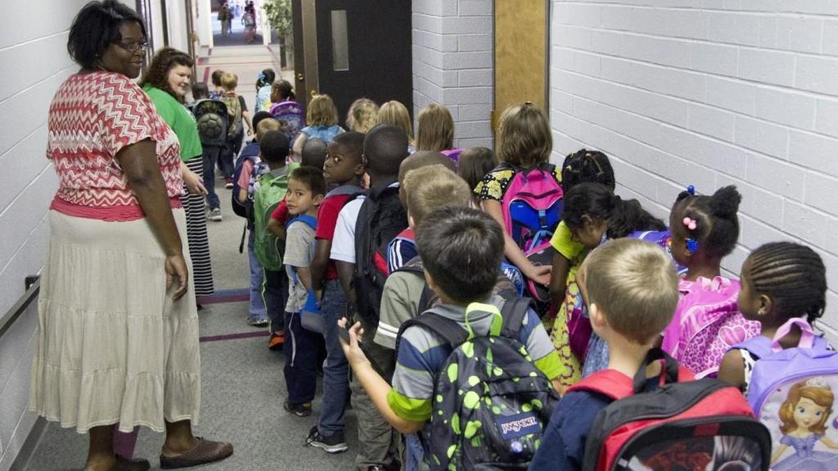 Teachers usher elementary students down the hall as they head for home at the end of the school day on at Raleigh Christian Academy in Raleigh on Aug. 21, 2014. In the 2016-17 school year, 90 students used taxpayer-funded vouchers to attend Raleigh Christian.