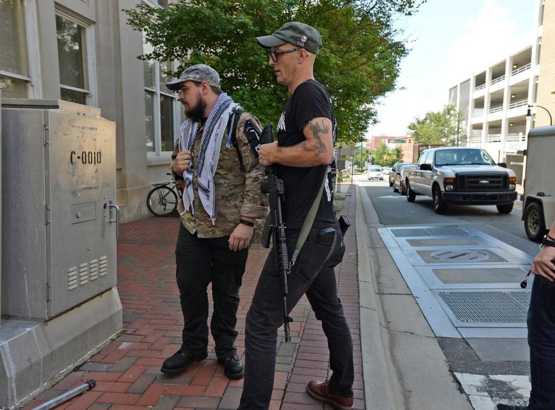 Dwayne Dixon, front, took a semi-automatic rifle to Durham on Aug. 18, 2017, to protest in anticipation of a march by the KKK in Durham. The KKK did not make an appearance.