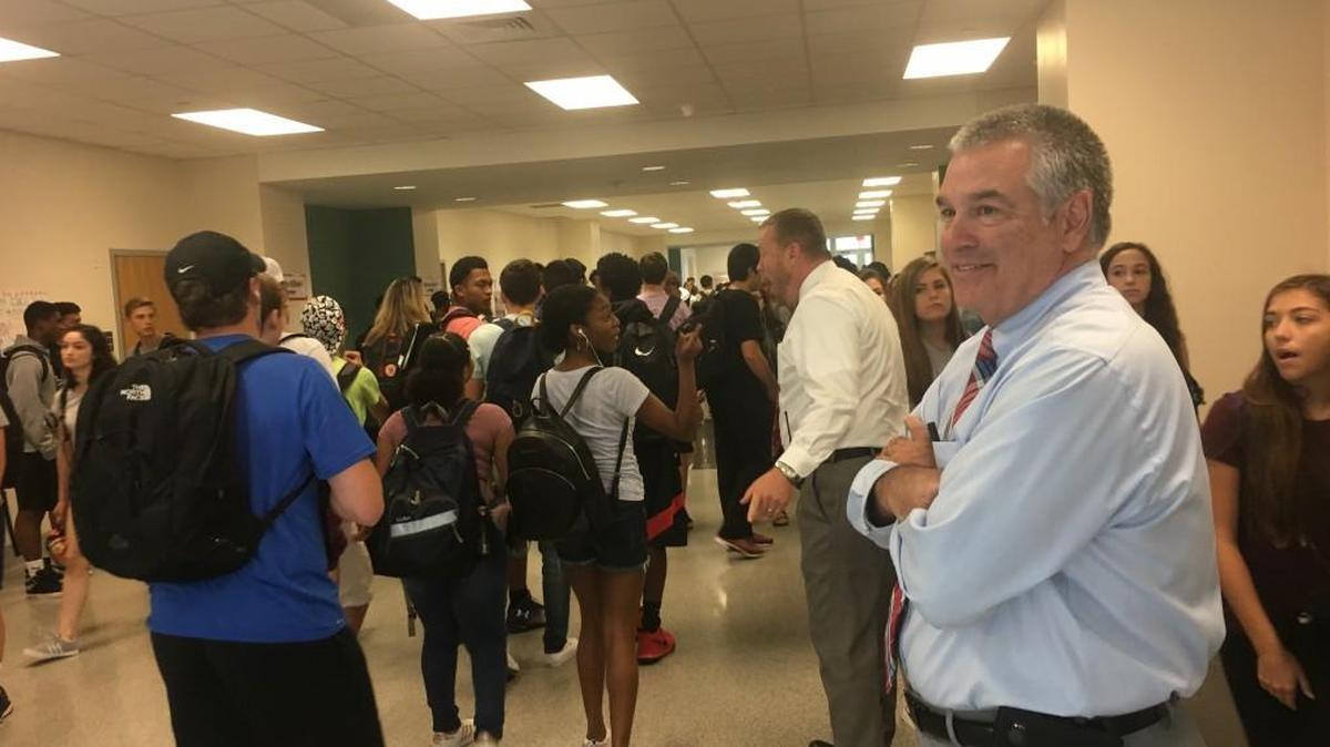 Matt Wight, principal of Apex Friendship High School in Apex, N.C., watches as students change classes on Sept. 13, 2017. North Carolina lawmakers changed the way principals are paid from a systemr based on experience to one based on students performance on exams.