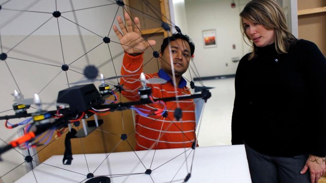 A student shows off an unmanned aerial vehicle at Elizabeth City State University’s mobile robotics lab in this 2014 file photo.