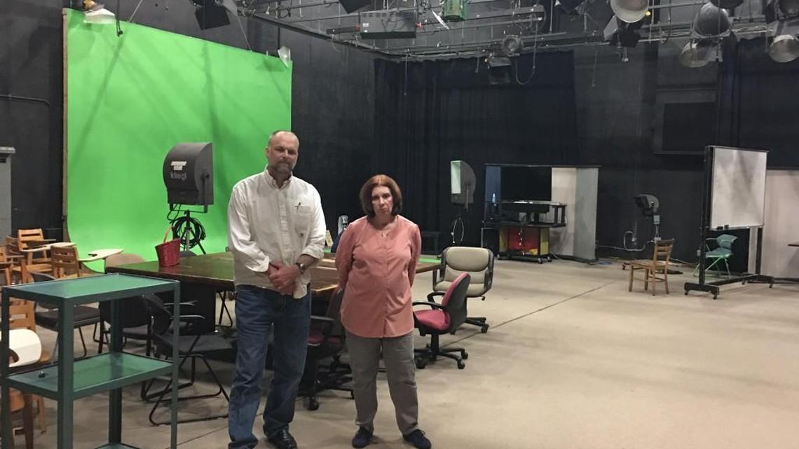 UNC-Chapel Hill professors Mark Robinson and Cori Dauber stand in an empty studio in Swain Hall. They had hoped to use a federal grant to fill the space with students developing multimedia to fight extremist groups.