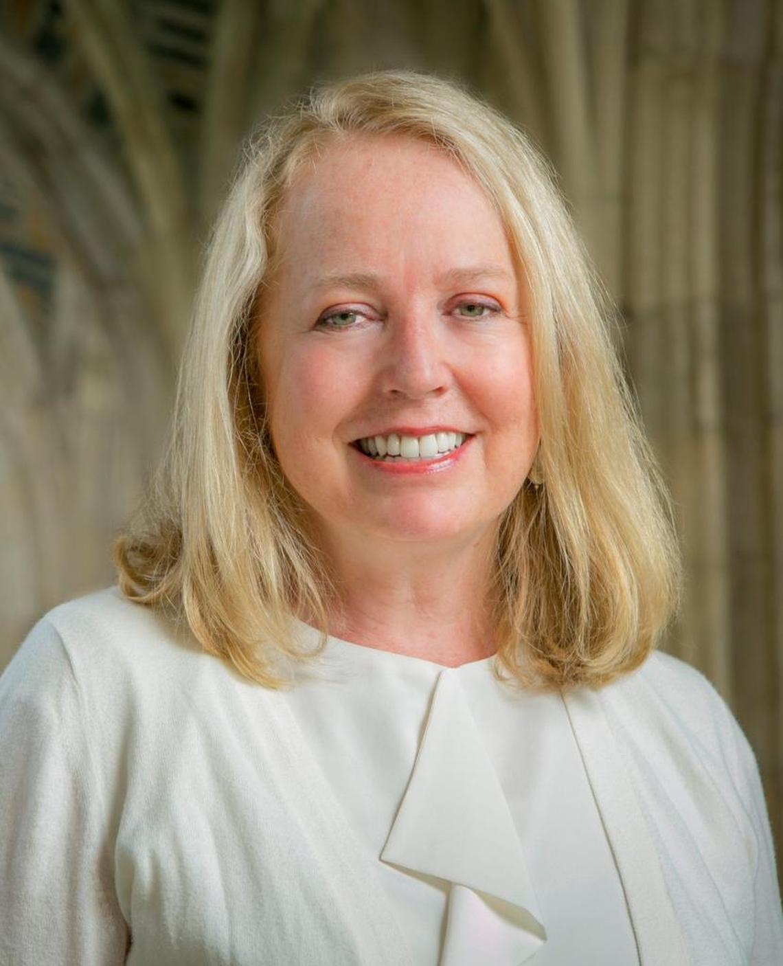 Dean of the Duke Divinity School Elaine Heath in the arcade of Duke Chapel.