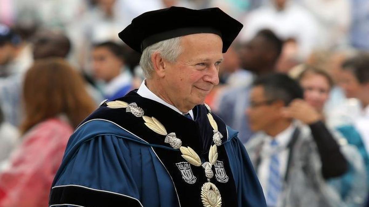 Duke University President Richard Brodhead enters the ballpark during the university's annual commencement ceremony at the Durham Bulls Athletic Park on Sunday, May 10, 2015.