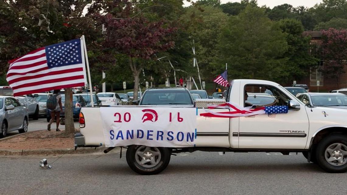 
Carter Popson pilots his decked out Toyota truck into the parking on the first day of school at Sanderson High School on Monday in Raleigh. Popson and other members of the Class of 2016 took part in the annual Senior Caravan of cars entering the school parking lot beneath an archway of ballons. Popson said he began decorating his truck last night in anticipation of an early morning.
