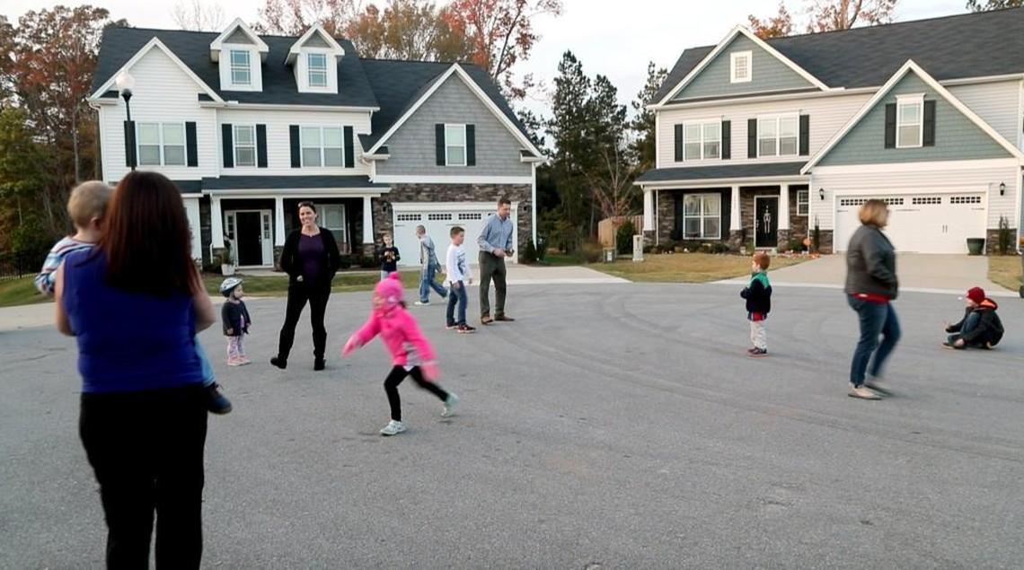 Kids and parents congregate to play and socialize in a cul-de-sac on Fauvette Lane after school in Holly Springs on Nov. 15, 2017.