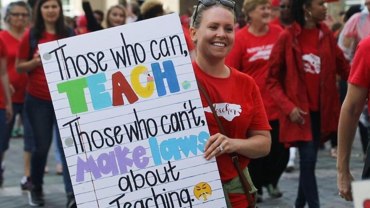 Thousands of teachers march on Fayetteville Street to the N.C. Legislative building in Raleigh, N.C. Wednesday, May 16, 2018 during the “March for Students and Rally for Respect,” the largest act of organized teacher political action in state history.