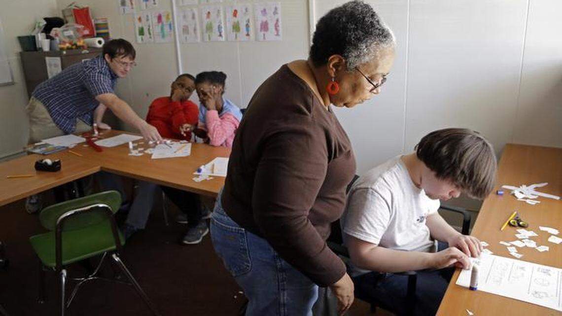 
Teaching assistant Mary Robinson, second from right, works with student Wesley Dunn, right, while teacher Peter Sjogren, left, works with Kolby Dunston, second from left, and Camille Edmonds, center, March 31 at Dynamic Community Charter School in Raleigh.
