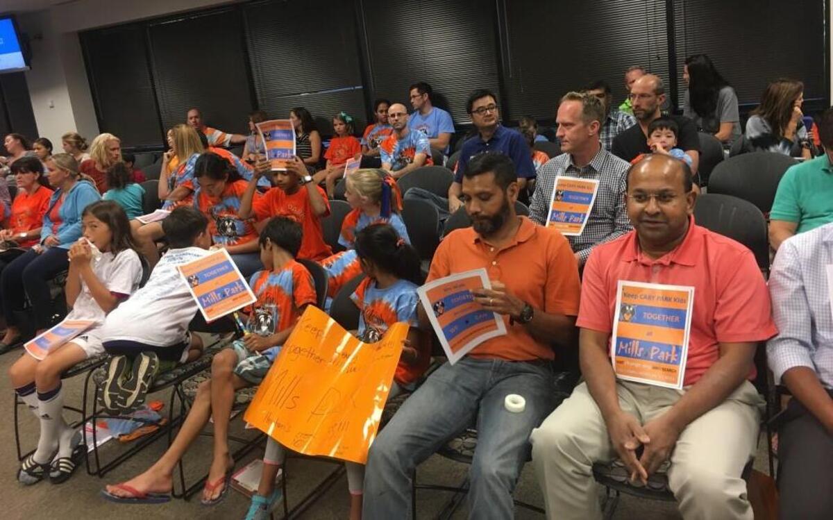 Cary Park families attend the Oct. 4, 2016 Wake County school board meeting to ask that students not be moved from Mills Park Elementary School to the new Hortons Creek Elementary School.