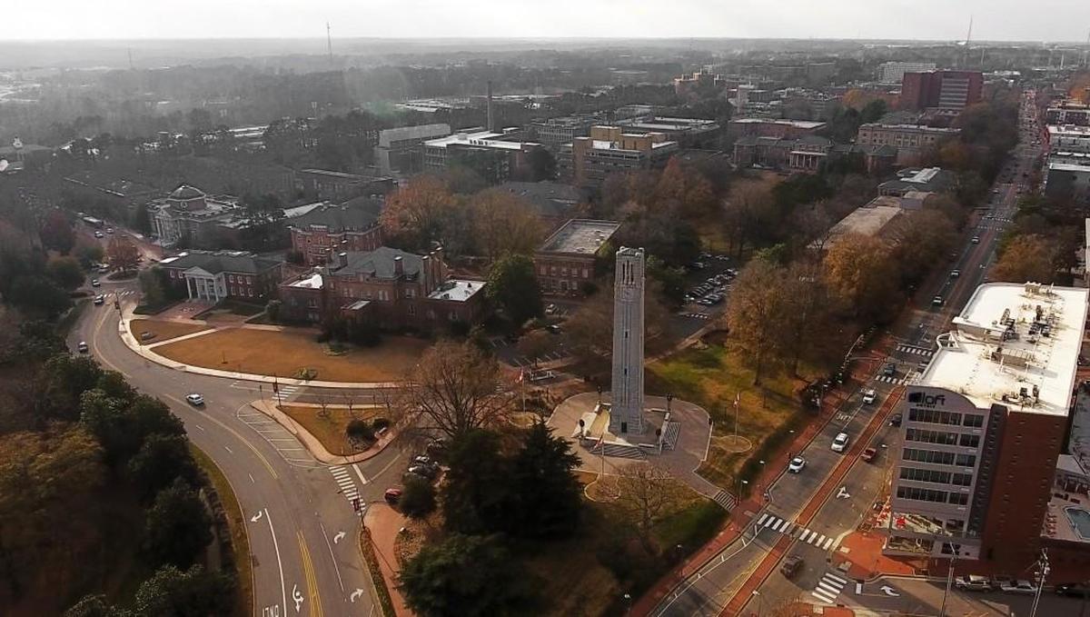 The N.C. State campus sprawls out behind the iconic bell tower on Hillsborough Street in Raleigh.