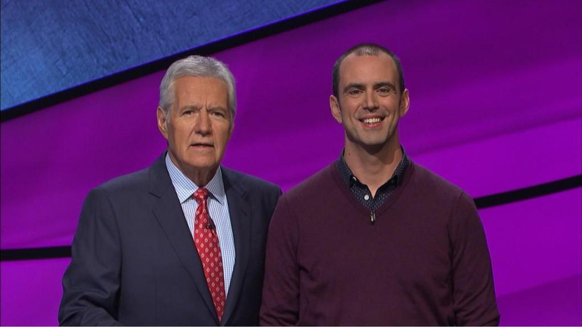 Lee Quinn, a teacher at Broughton High School in Raleigh, with “Jeopardy!” host Alex Trebek.