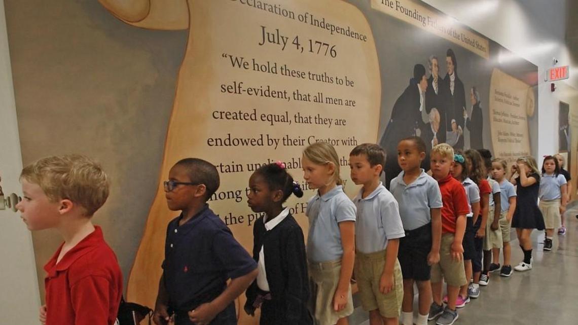 First-graders line up in a hallway at the private Thales Academy in Knightdale, N.C., on July 20, 2017. A majority of private school students in North Carolina now get financial assistance from taxpayers.