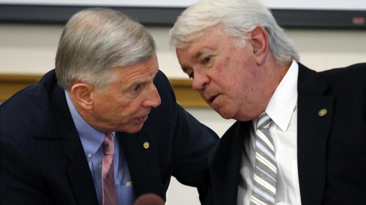 From left, UNC System president Tom Ross and UNC Board of Governors Vice Chair Louis Bissette, Jr. quietly confer during aUNC Board of Governors meeting in Chapel Hill Friday, November 13, 2015.