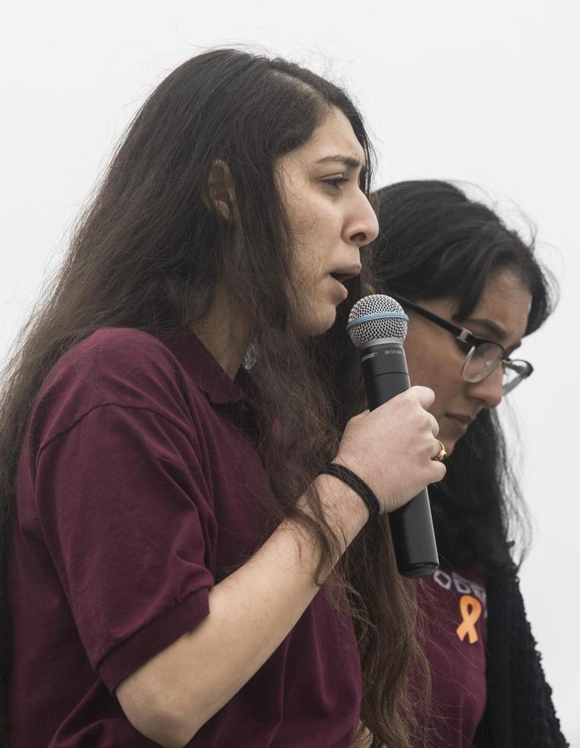 Former Marjory Stoneman Douglas High School students and current Green Hope High students Megan Sharma, foreground, and Deb Bhattacharya speak to more than 2,000 classmates and who walked out of Green Hope High School in Cary on Wednesday, Feb. 28, 2018 to demand political changes to try to end school gun violence following the recent Florida school shooting.