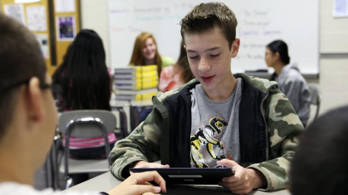 Spencer Maldonado, of Cary works with a tablet at East Cary Middle School in this 2013 file photo. Wake County student assignment staff are on longer recommending moving xtudents from Davis Drive and Dillard Drive middle schools to East Cary Middle.
