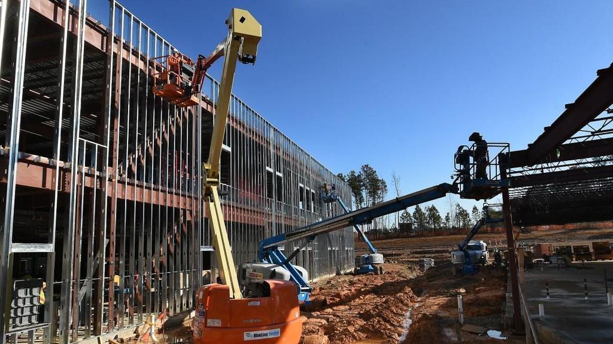 In December 2015, construction workers scrambled to complete Oakview Elementary School in Holly Springs, built with funds from an $810 million bond issue approved by voters in 2013.