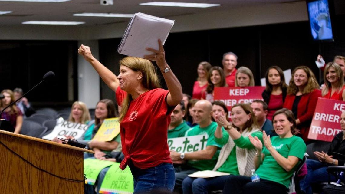 Lesley Nager raises her hands in the air after speaking about the Brier Creek community during the Wake County student assignment hearing Tuesday, November 3, 2015 in Cary, N.C.