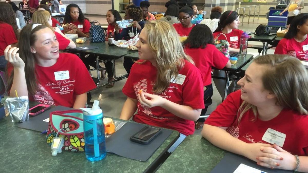 Heritage High School ninth graders, from left, Teresa Hupp, Emmalee Norris and Savannah Parsons have lunch during the She Leads event Friday, March 11, 2016 Southeast Raleigh Magnet High School.