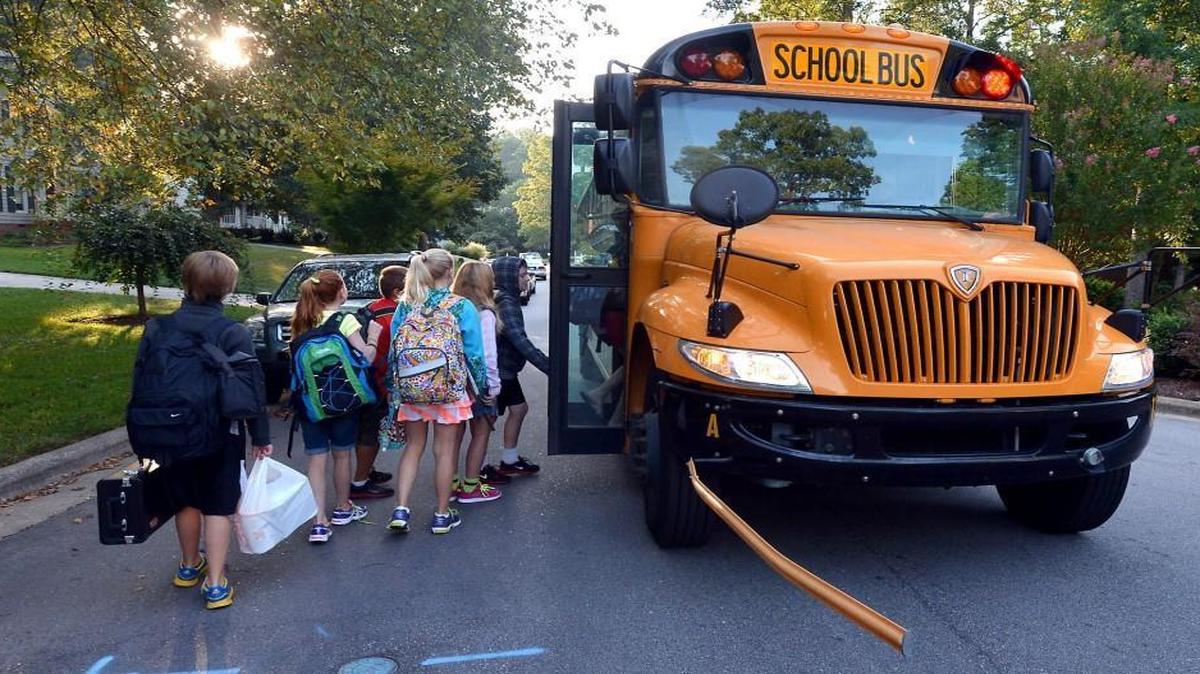Wake County students head for their school bus on Aug. 26, 2013.
