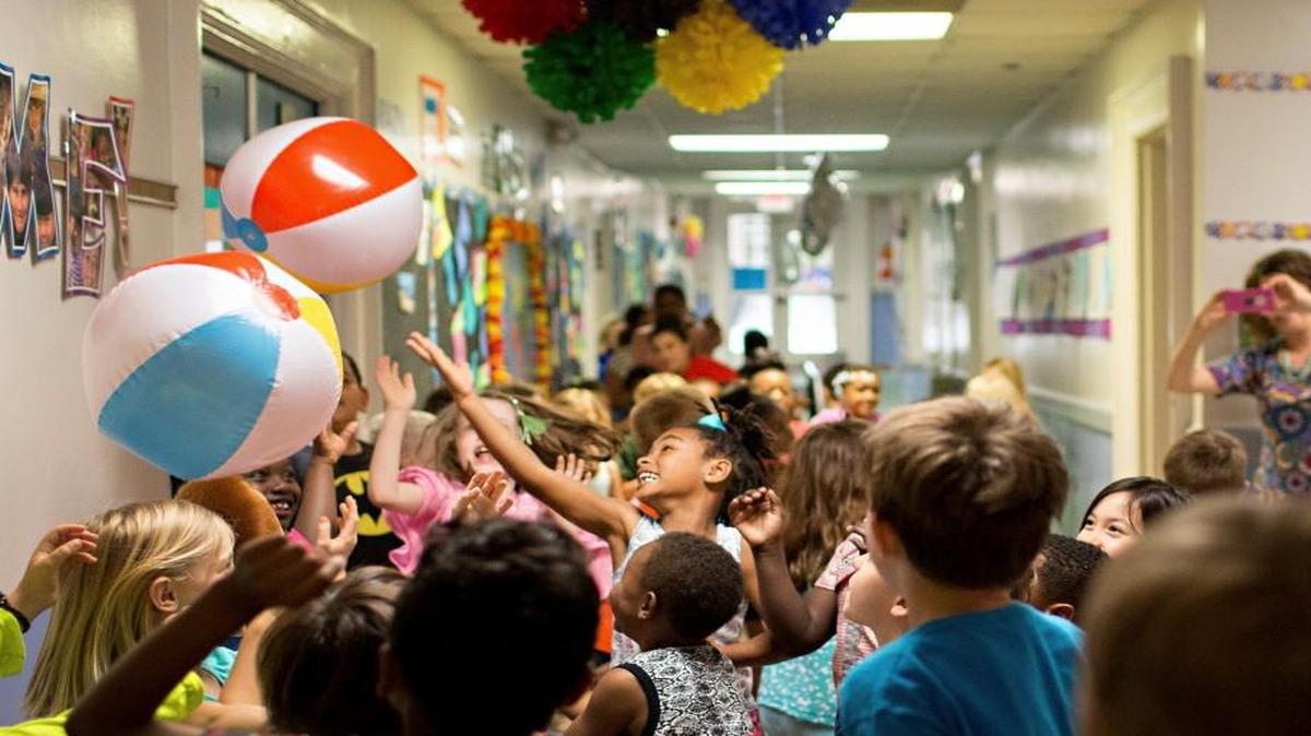Wiley Elementary School students celebrate in the hallway after it was announced that the school was named the top magnet elementary school in the nation by Magnet Schools of America Monday, May 9, 2016 in Raleigh, N.C.