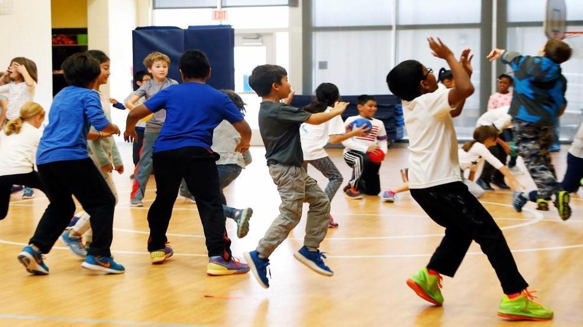 Third graders play during gym class at Mills Park Elementary in Cary on Nov. 22, 2016. School leaders say reducing class sizes to meet new state limits will force them to consider options such as cutting physical education and arts classes, raising class sizes in upper grades and asking counties to pick up the tab.