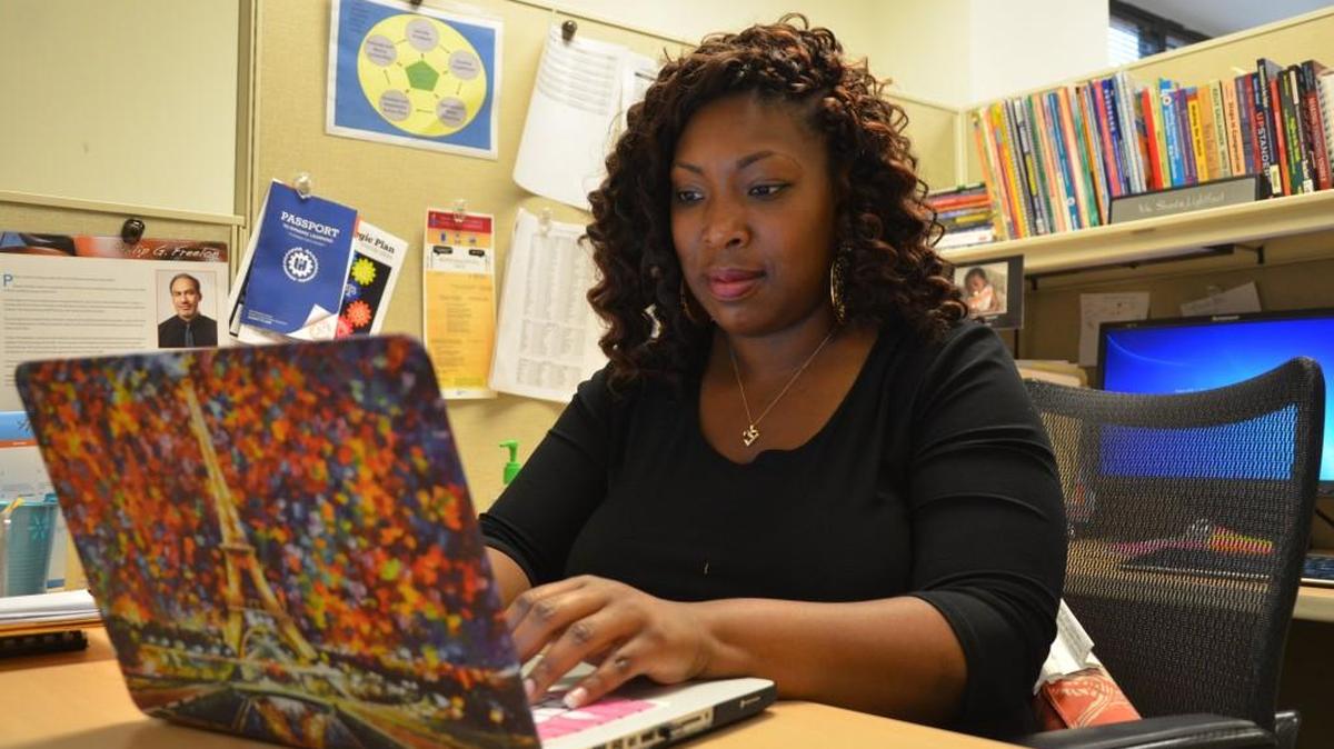 Shanta Lightfoot, senior administrator for middle school English language arts for Wake County schools, works in her office last June. Lightfoot was a teaching fellow at N.C. State University before graduating in 2008.