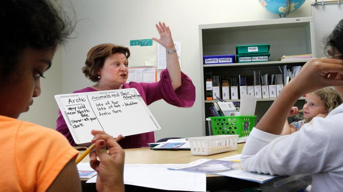 Karen Berryman, a teacher at Turner Creek Elementary School in Cary, instructs second graders during a reading workshop on June 6, 2012. School officials are citing uncertainty about new state K-3 class size changes with needing to change the tracks of some students for the 2017-18 school year.