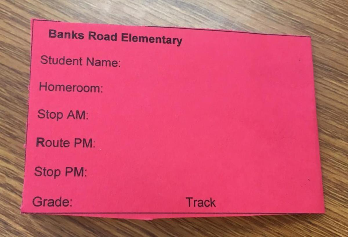 Tags such as this one will be placed on the book bags of all Wake County elementary school students with contact and bus information.