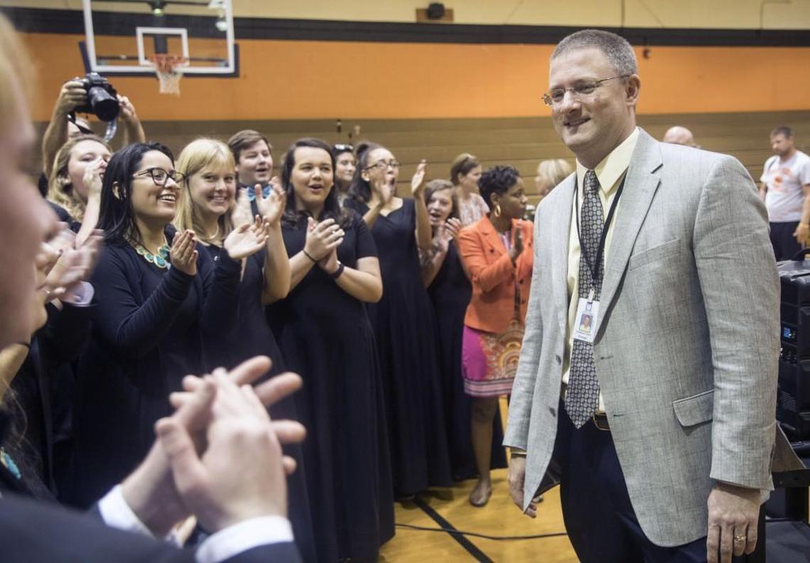 Jonathan Enns, principal of Fuquay-Varina High School, is congratulated during a pep rally in his honor after being named Wake County 2017 Principal of the Year Friday, Oct. 6, 2017 at the school.