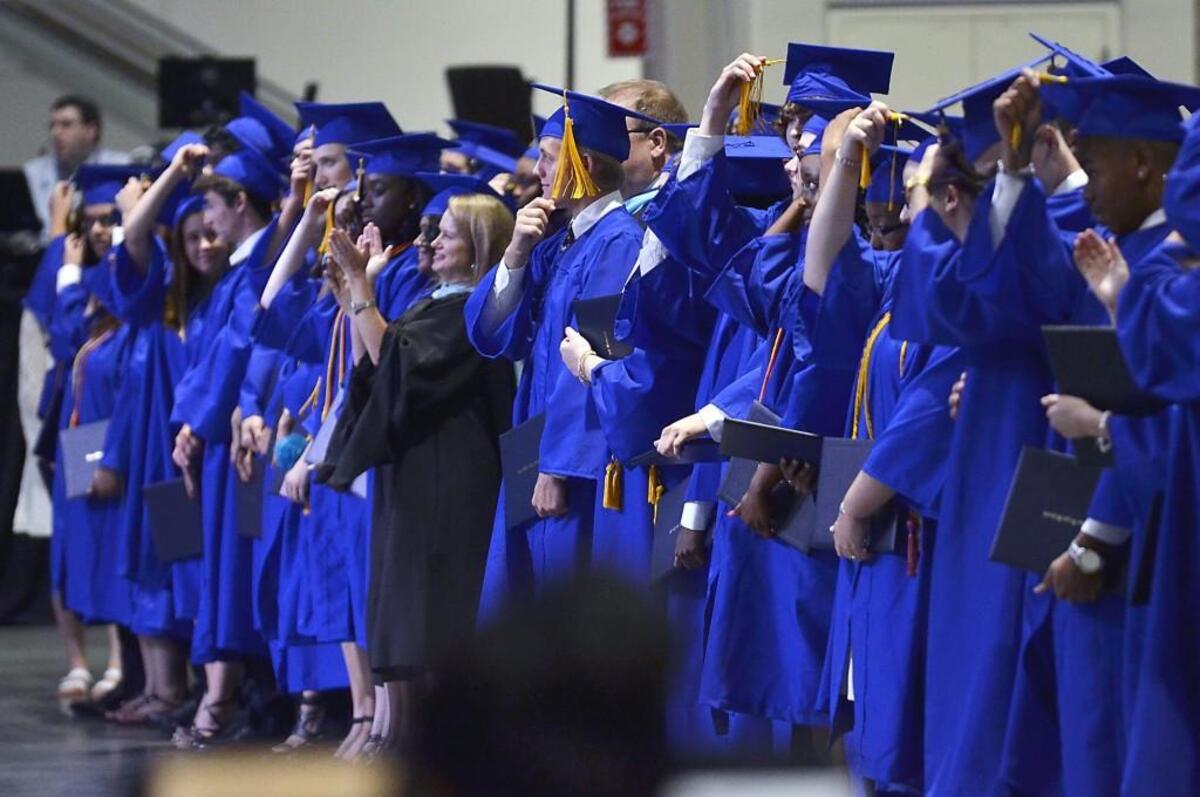 East Wake High School students turn their tassels to become graduates at the Raleigh Convention Center on June 10, 2016. East Wake was among the high schools recognized by North Carolina for having a high graduation rate during the 2015-16 school year.