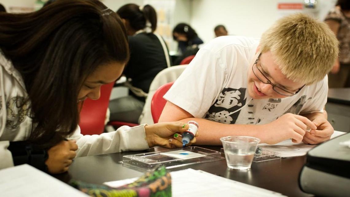 Two Wake STEM Early College High School students work in earth science class.