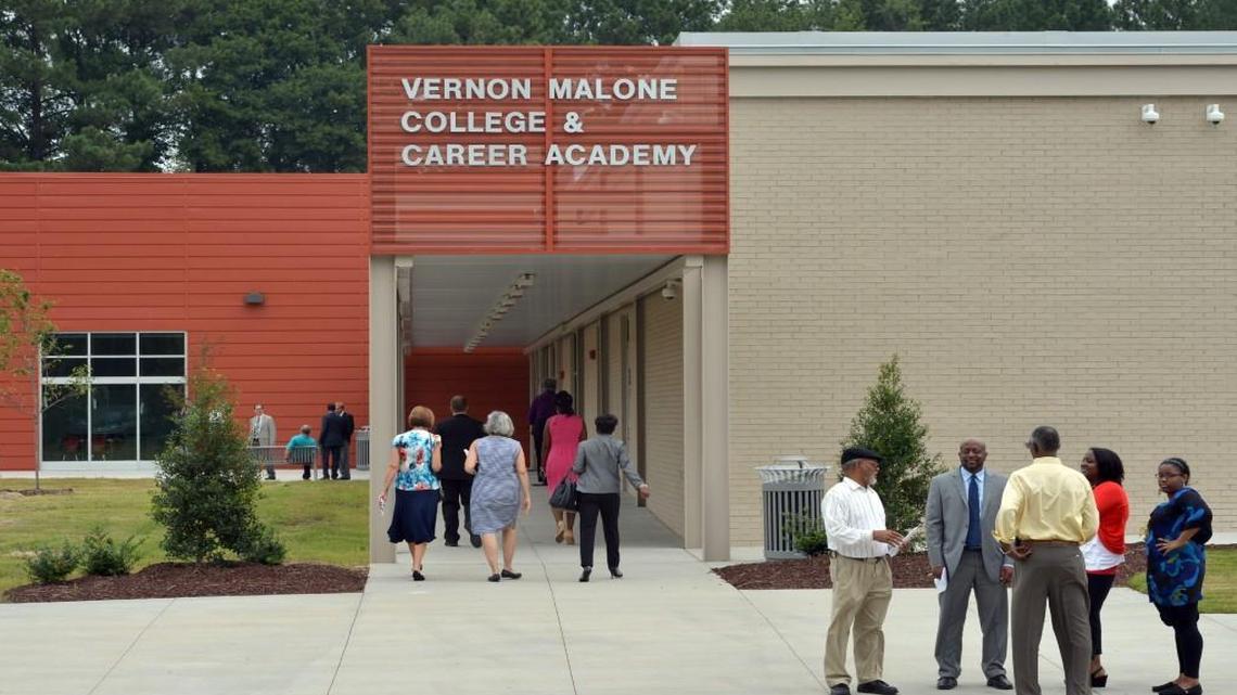 Visitors mingle as they tour the Vernon Malone College & Career Academy on South Wilmington Street in Raleigh on Aug. 8, 2014.