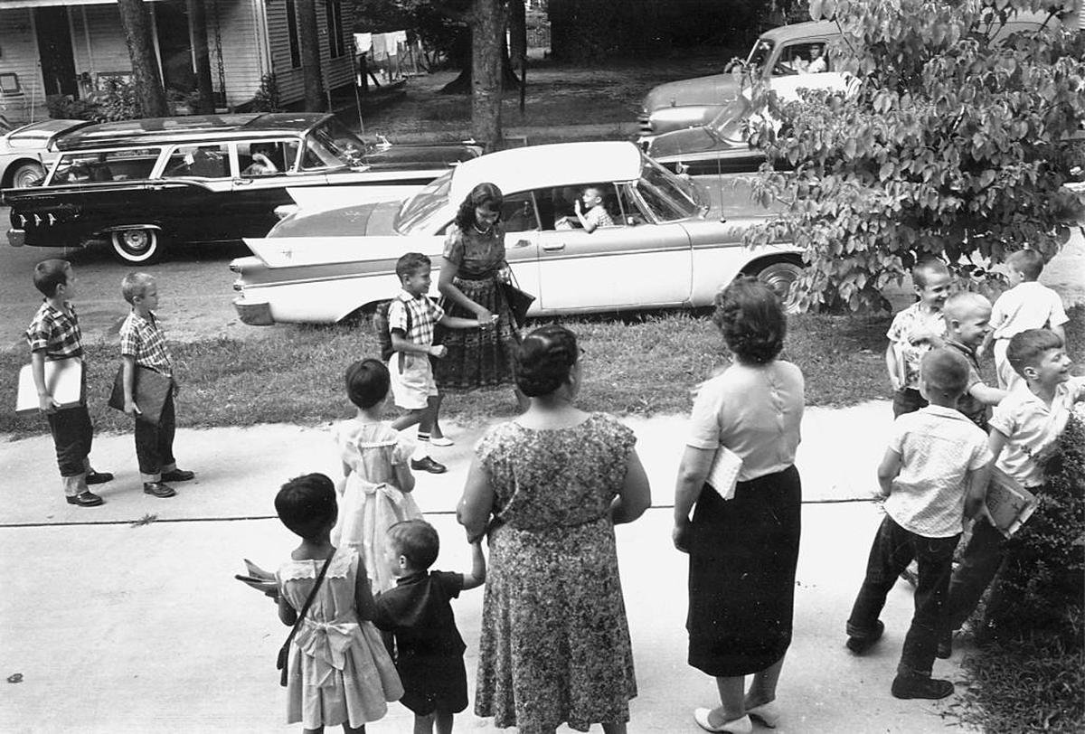 June Campbell walks with her 7-year-old son, William Campbell to Murphey School in Raleigh in September 1960. Bill Campbell was the first black student to integrate an all-white Raleigh school.