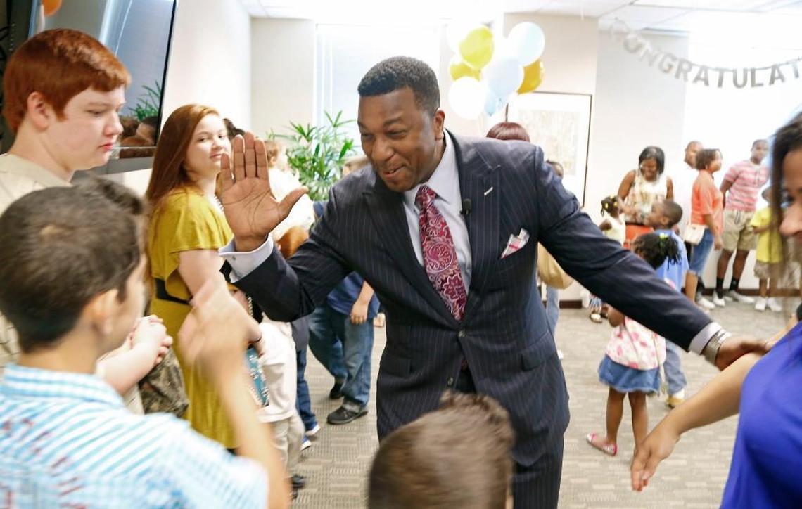 Darrell Allison, center, president of Parents for Educational Freedom in North Carolina greets families and supporters in this 2015 file photo as they celebrate the news that the N.C. Supreme Court has declared school voucher programs to be constitutional. Allison is leaving the group Feb. 28, 2018 to take a leadership position with the American Federation For Children.