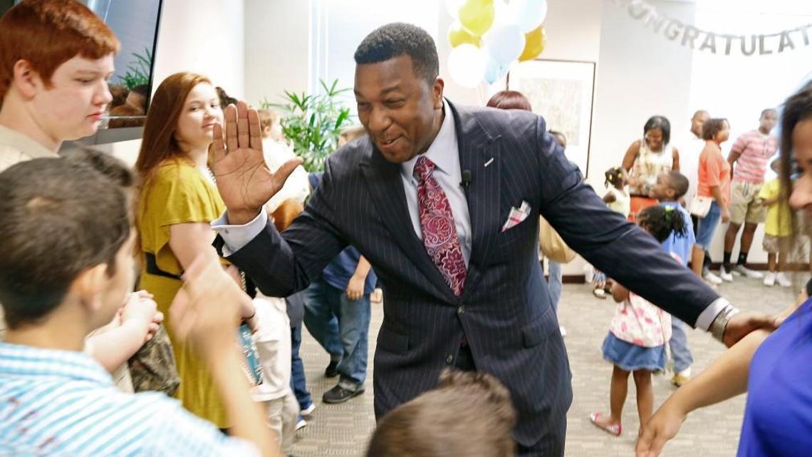 Darrell Allison, center, president of Parents for Educational Freedom in North Carolina greets families and supporters in this 2015 file photo as they celebrate the news that the N.C. Supreme Court has declared school voucher programs to be constitutional. Allison is leaving the group Feb. 28, 2018 to take a leadership position with the American Federation For Children.