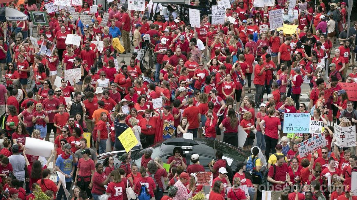 Thousands of North Carolina teachers descend upon the entrance to the Legislature to lobby for better pay, and funding for education on Wednesday, May 16, 2018 in Raleigh, N.C.