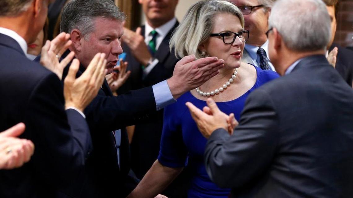 Margaret Spellings is given a standing ovation as she is escorted into the room after being elected president of the University of North Carolina system during a meeting of the UNC Board of Governors at the Spangler Center in Chapel Hill, N.C., Friday, Oct 23, 2015.