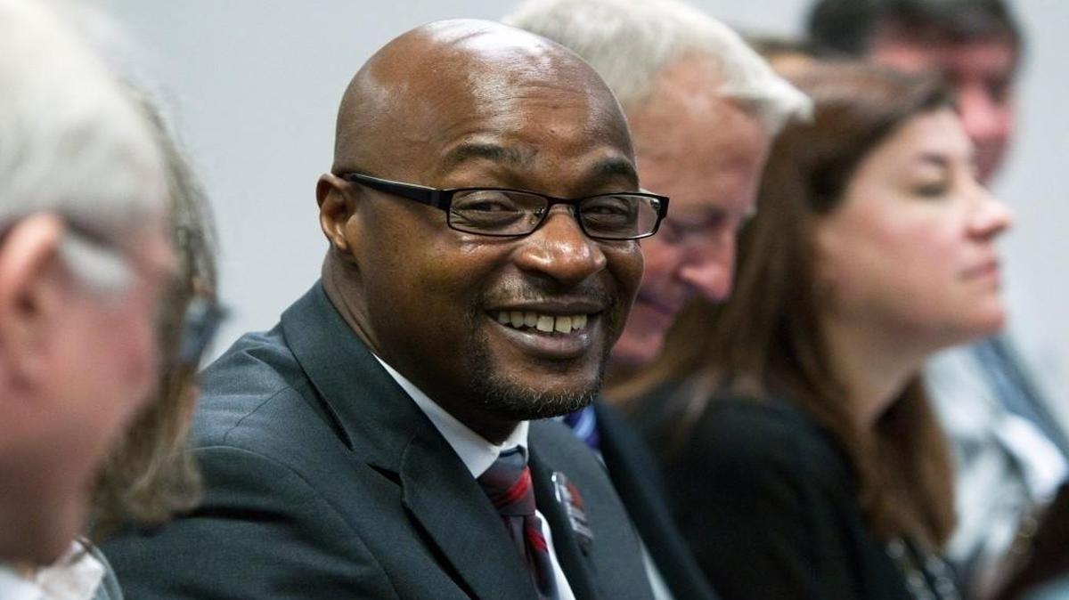 Rodney Ellis, President of the North Carolina Association of Educators (NCAE), smiles as Superior Court judge Robert Hobgood gives his ruling that North Carolina's school voucher program is unconstitutional in a Wake County courtroom on August 21, 2014.