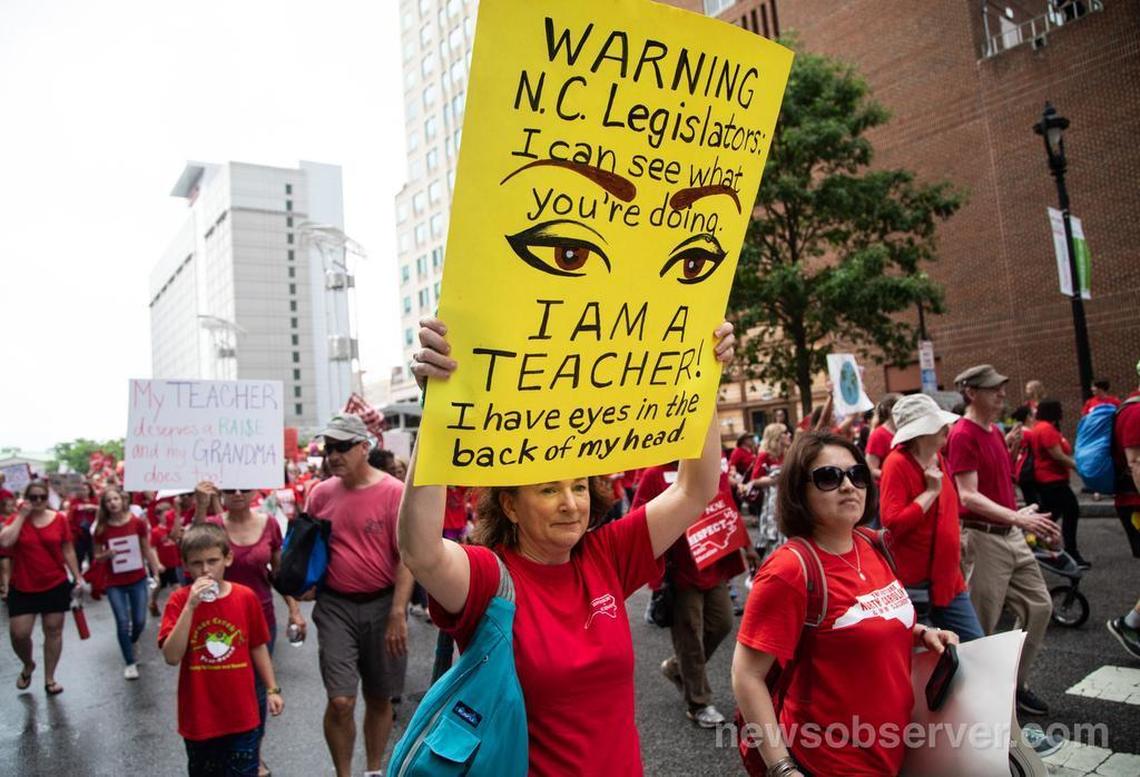 Thousands of teachers march on Fayetteville Street to the N.C. Legislative building in Raleigh, N.C. Wednesday, May 16, 2018 during the “March for Students and Rally for Respect,” the largest act of organized teacher political action in state history.
