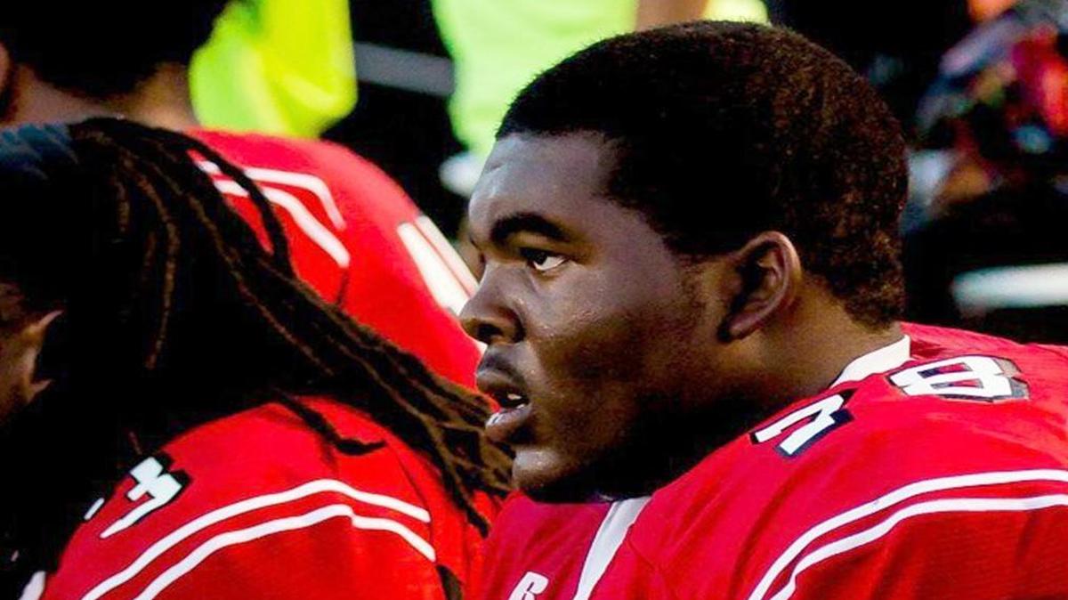 Isaiah Langston sits among teammates during Rolesville High School’s home opener against Panther Creek High on September 5, 2014. Langston, a junior linebacker for the Rams, died after collapsing on the field and being rushed to the hospital Friday, Sept. 26, 2014.