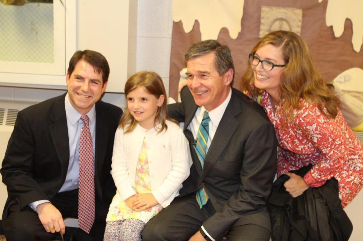 From left, Will Edgar, Sarah Edgar, Roy Cooper and Cary Edgar. Sarah Edgar wrote Cooper a letter inviting him to visit her school, Combs Elementary School in Raleigh. Will and Cary are Sarah’s parents.