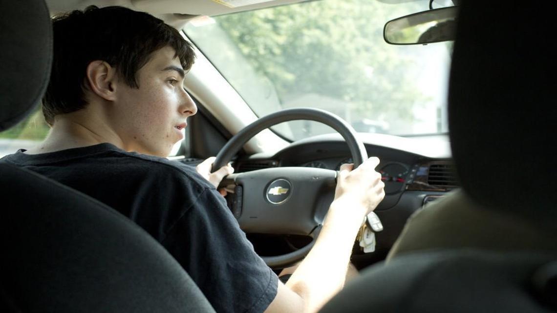 
Asher Philips, 15, looks right before making a turn during the the behind-the-wheel portion of the driver's education program run by Jordan Driving School in August.
